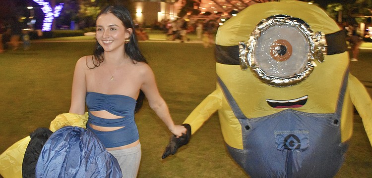 Leisa Wilhelm leads her boyfriend Austin Bronkhorst across the park.