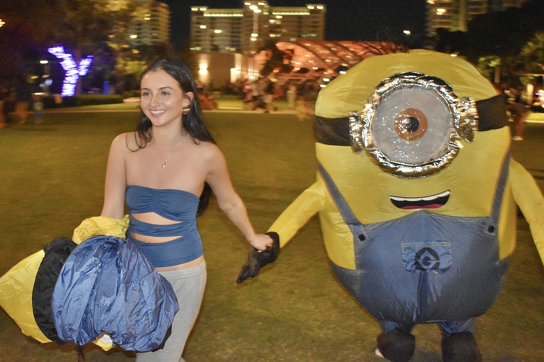 Leisa Wilhelm leads her boyfriend Austin Bronkhorst across the park.