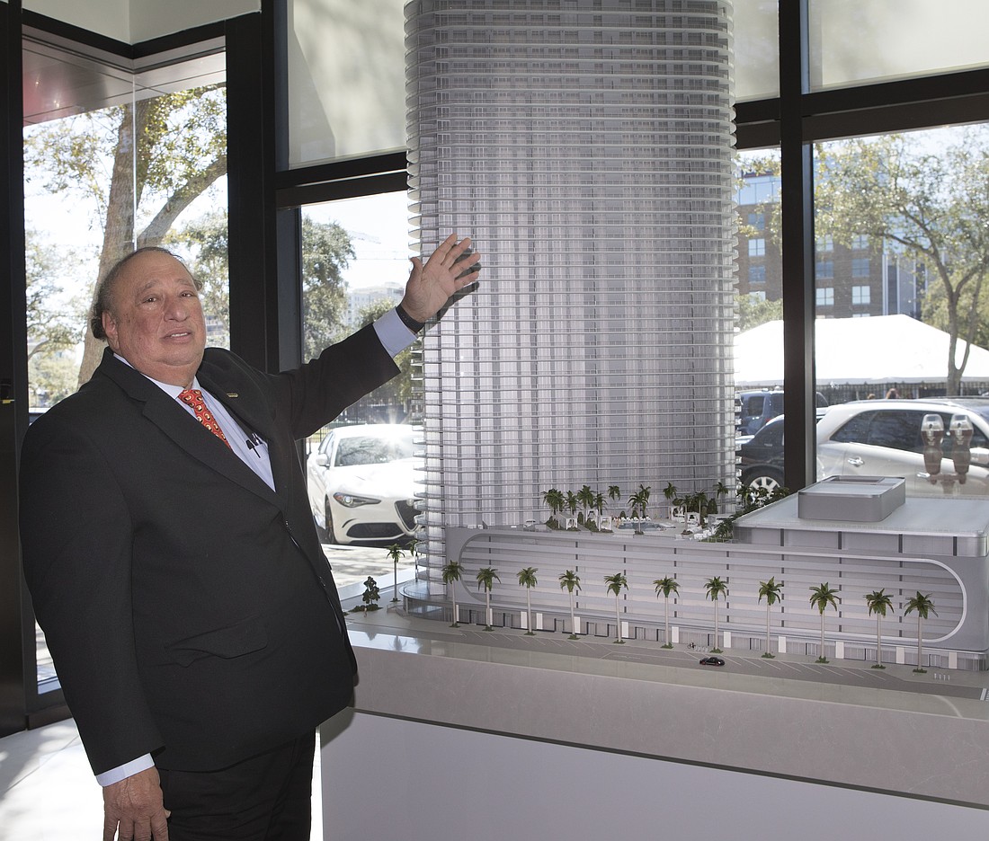 John Catsimatidis Sr., the owner of the New York-based real estate firm Red Apple Group, poses with a rendering of the Residences at 400 Central in St. Petersburg.