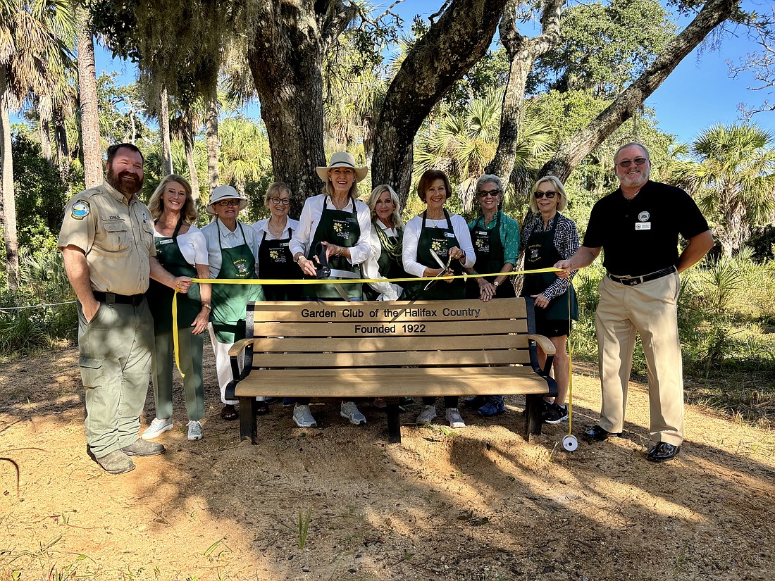 Tomoka State Park Ranger David Jones, City Commissioner Lori Tolland, Garden Club of Halifax Country members and Gordon Whitley, president of the Friends of Tomoka Basin State Parks, celebrate a ribbon-cutting for the new bench. Courtesy photo
