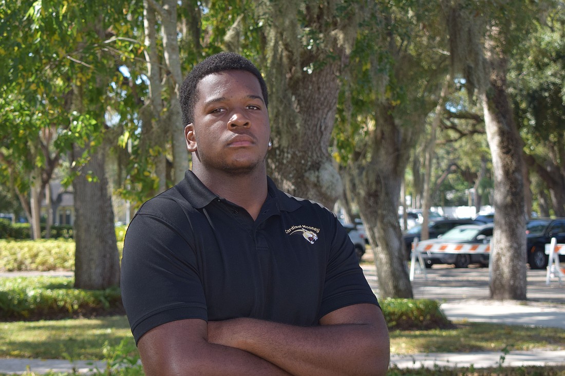 Elijah Golden poses for a photo on Oct. 17 at Cardinal Mooney Catholic High School. After seasons with King George (VA) and IMG Academy, he's found a home with Cardinal Mooney, and has helped the squad to the state's No. 1 overall ranking.