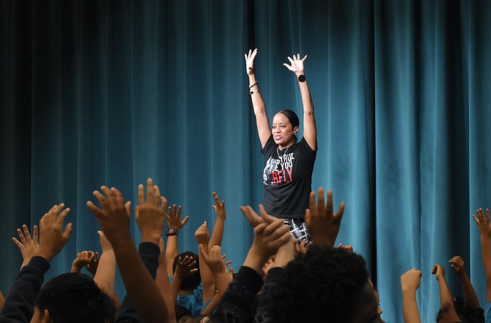 Paige Hernandez leads students.