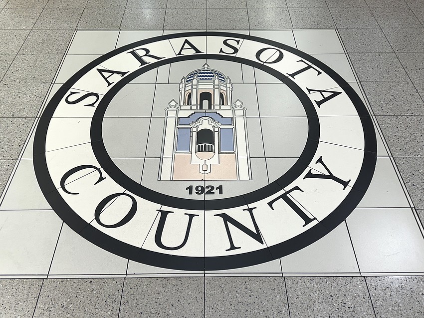 The Sarasota County Seal in floor tiles remains in the foyer at the 1660 Ringling Blvd.