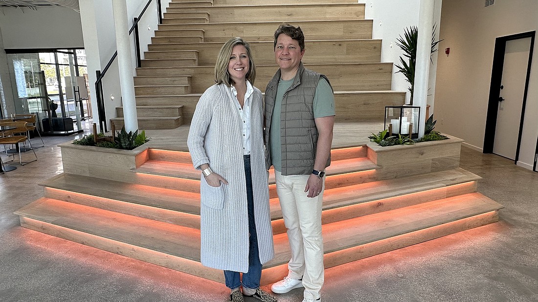 Industry West founders and owners Anne and Jordan England in the central
amphitheater and stadium seating area at their new headquarters at 1001 Kings Ave. in this 2023 photo.
