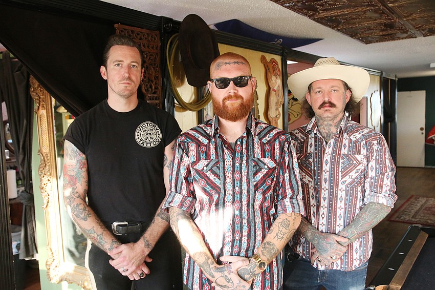 Bobby Ellis, Desmond Larmer and Drew McElveney, of Victory Tattoo. Photo by Jarleene Almenas