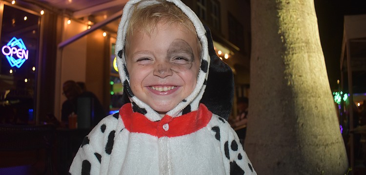 After a fun filled night at Boo Fest on Lakewood Ranch Main Street, Bradenton's Lennox Craig, 3, is all smiles dressed as one of the 101 dalmations.