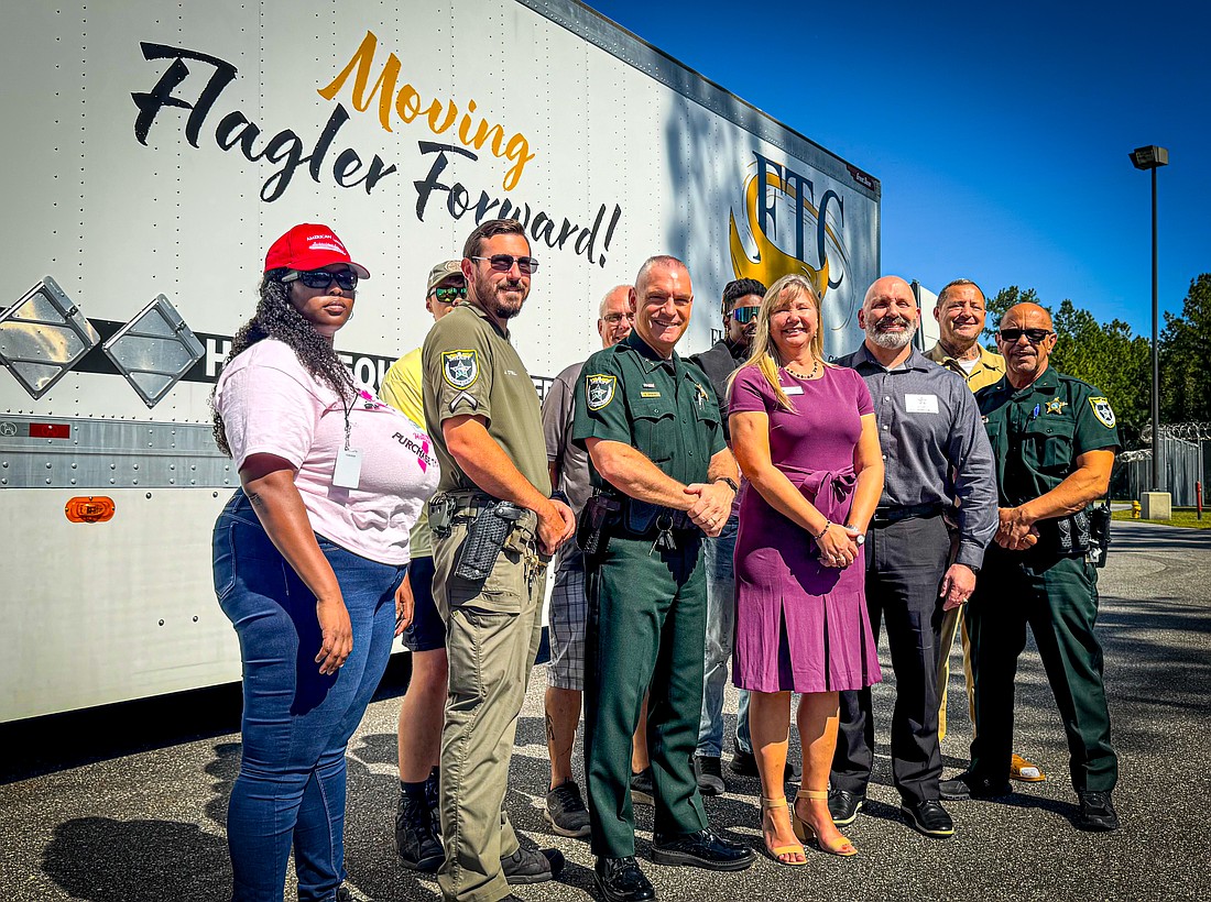 Flagler County Sheriff's Office and Flagler Technical College officials at the presentation of the newly decorated FTC trailer. Courtesy photo/Flagler Schools