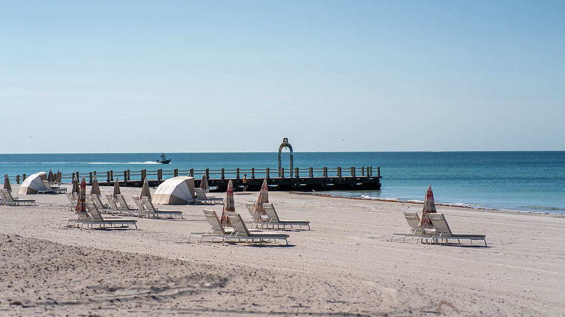 St. Regis Longboat Key Resort installed a stainless steel metal arch on a converted groin extending into the Gulf. Longboat Key town staff asked the hotel to take the arch down because it does not follow town code.