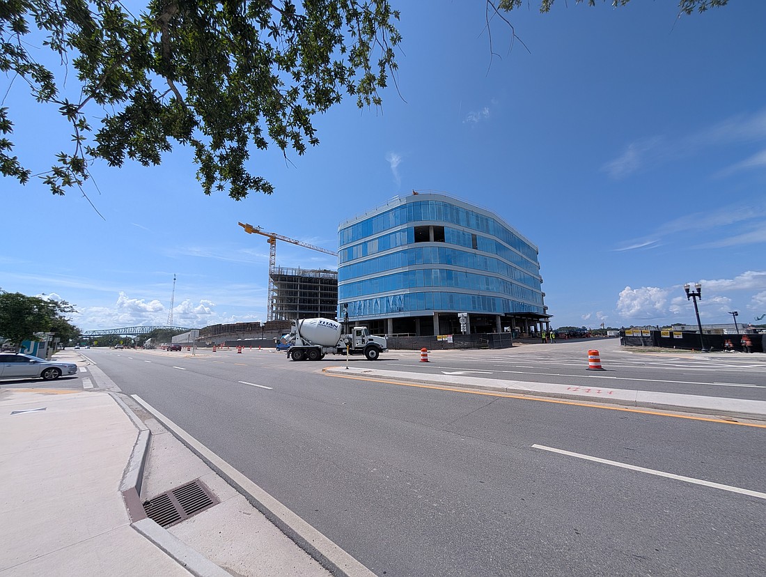 Bay Street in front of the  One Shipyards Place office building, the future offices of the Jacksonville Jaguars, and the Four Seasons Hotel and Residences. This photo is from June 2025.