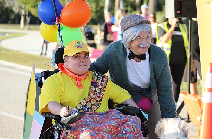 This year makes 22 years of the Boo Run, which has been referred to as the "day of Grayson." Grayson Tullio dresses as Russell from the Disney movie "Up" while his great friend Monika Oberer dresses as his Carl Fredricksen.
