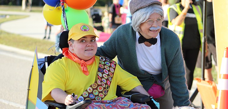 This year makes 22 years of the Boo Run, which has been referred to as the "day of Grayson." Grayson Tullio dresses as Russell from the Disney movie "Up" while his great friend Monika Oberer dresses as his Carl Fredricksen.