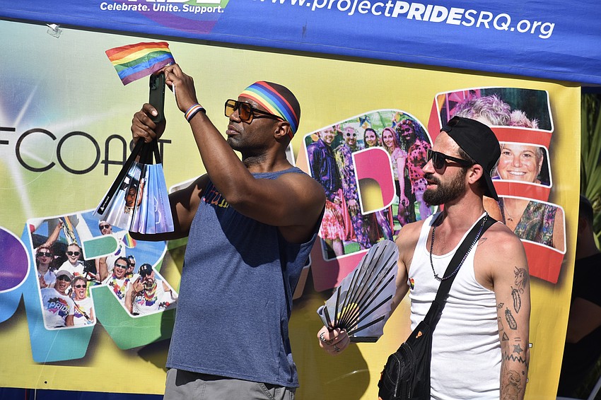 Eric Ellis and his friend Derrick Koellhoffer listen to the music.
