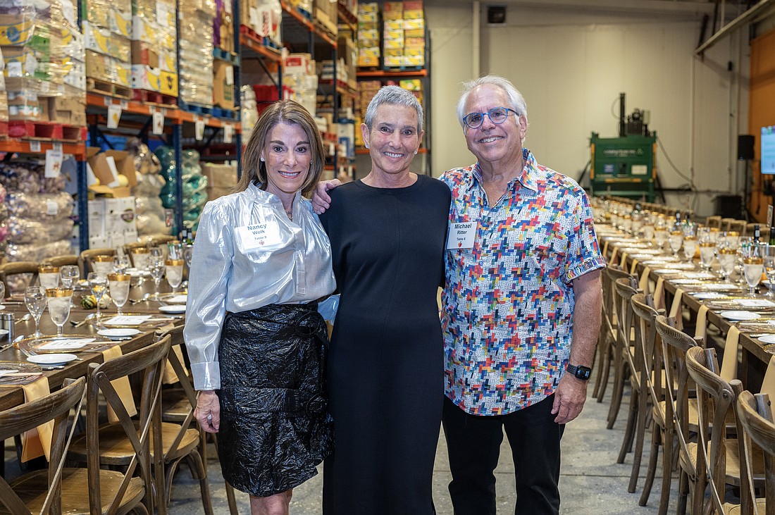 Nancy Wolk, All Faiths President and CEO Nelle Miller and Michael Ritter