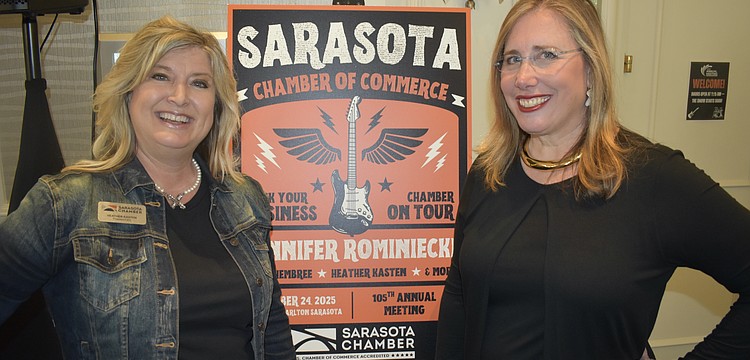 Heather Kasten stands with incoming board chair Jennifer Rominkiecki.