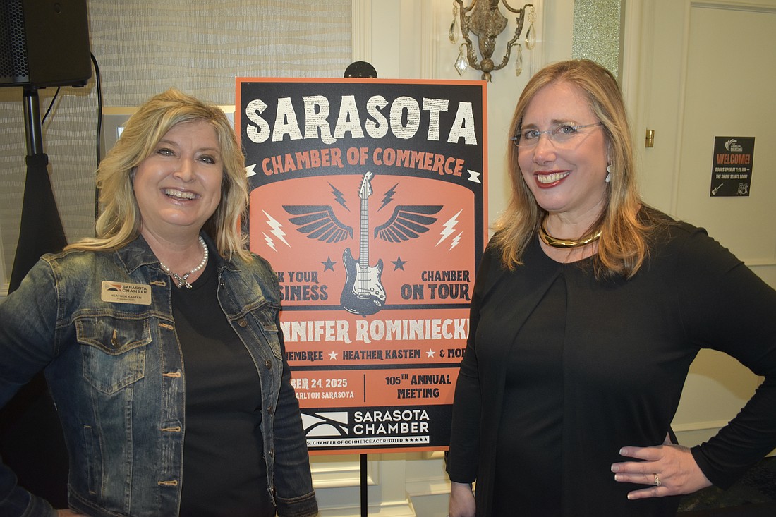 Heather Kasten stands with incoming board chair Jennifer Rominkiecki.