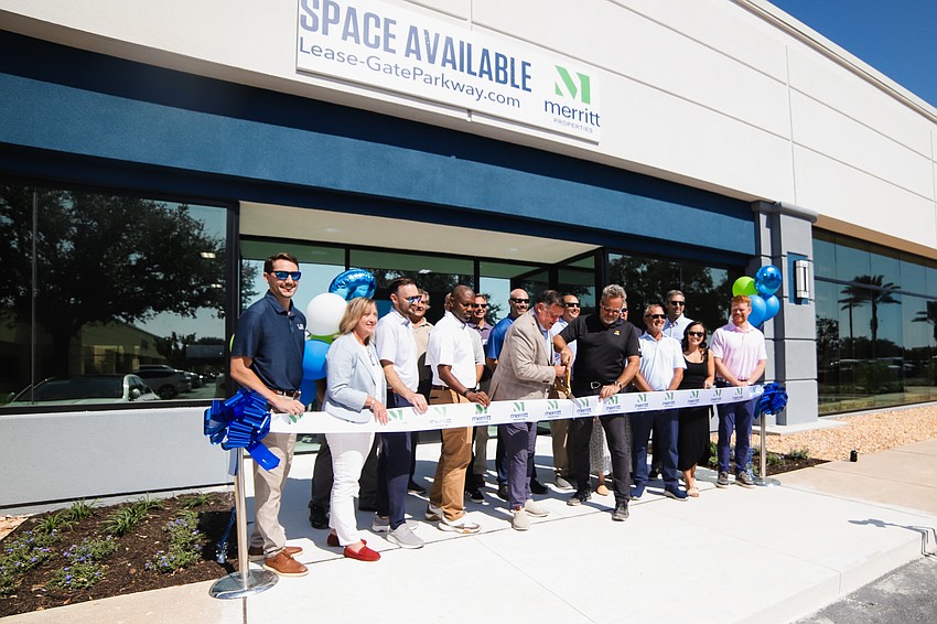 Patrick Franklin, Florida regional director of Merritt Properties, cut the ribbon Oct. 22 marking the completion of the first phase of redevelopment of the Merritt at Gate Parkway light industrial park in South Jacksonville. Patrick Franklin, Florida regional director of Merritt Properties, cut the ribbon Oct. 22 marking the completion of the first phase of redevelopment of the Merritt at Gate Parkway light industrial park in South Jacksonville.