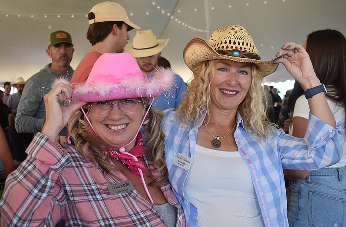 Bank OZK's Lisa Lawler and Kate Mulligan, executive director of the Lakewood Ranch Community Foundation, are among those who dressed in Western attire for the 36th annual Hob Nob Oct. 29 at the Lakewood Ranch Library.