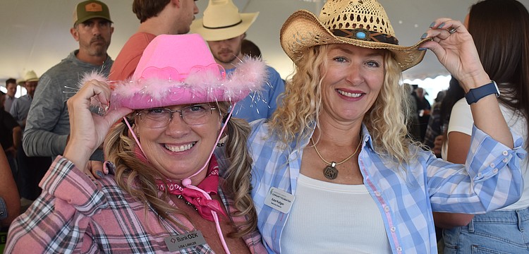 Bank OZK's Lisa Lawler and Kate Mulligan, executive director of the Lakewood Ranch Community Foundation, are among those who dressed in Western attire for the 36th annual Hob Nob Oct. 29 at the Lakewood Ranch Library.