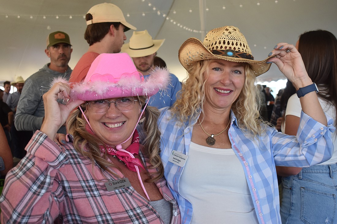 Bank OZK's Lisa Lawler and Kate Mulligan, executive director of the Lakewood Ranch Community Foundation, are among those who dressed in Western attire for the 36th annual Hob Nob Oct. 29 at the Lakewood Ranch Library.