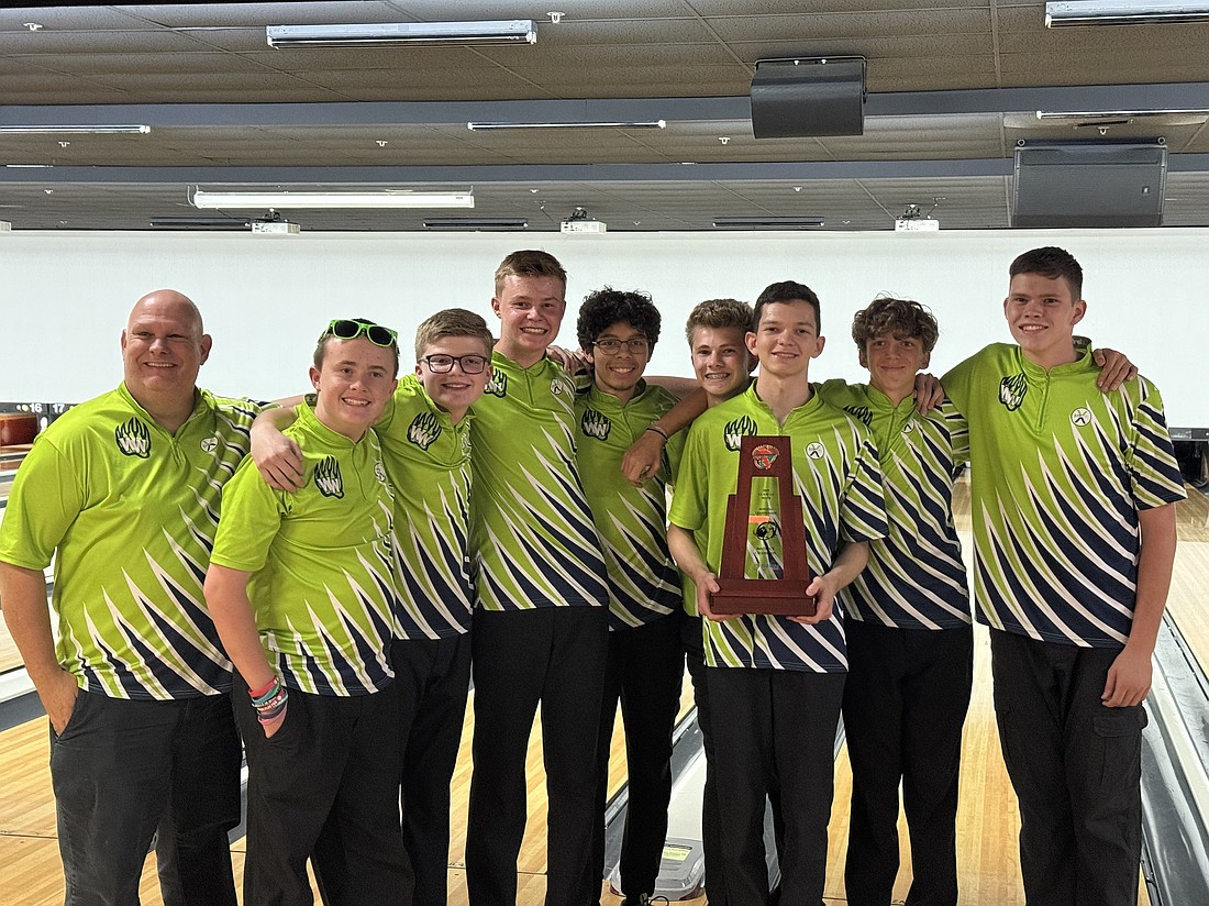 Head coach Joe Amendola celebrated with Windermere’s boys bowling team after it won the District Championship for the first time in school history.
