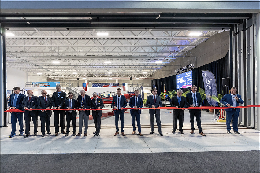 Aura Aero executives and local elected officials and business leaders cut the ribbon on Wednesday, Oct. 29, for the company's new facility in Daytona Beach. Photo courtesy of Embry-Riddle Aeronautical University/Daryl LaBello