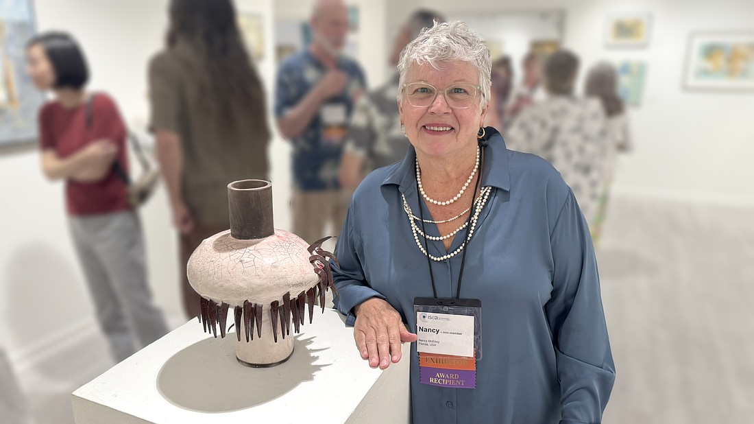 Nancy McElroy, of Ormond Beach, with her piece, "Solo." Courtesy photo