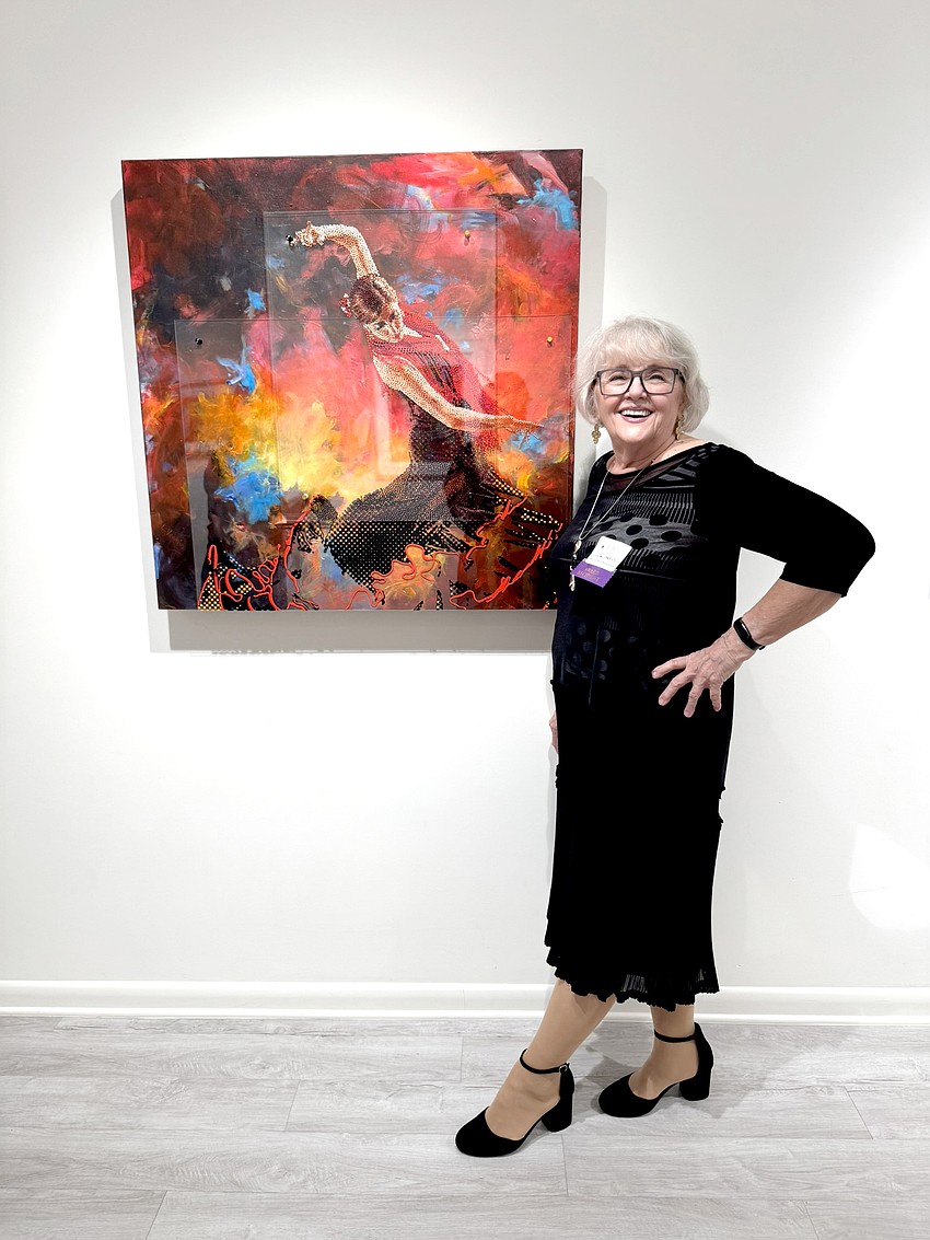 Lillian Verkins, of Altamonte Springs, with the piece she made in collaboration with Ormond Beach resident Robert Shirk,
