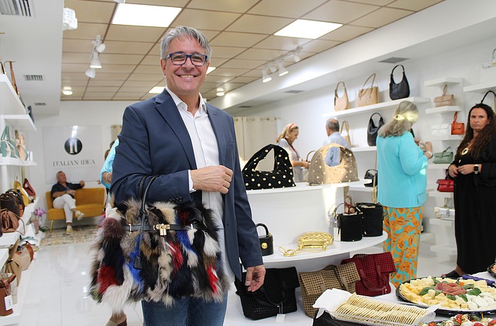 Christian Delunas, retail general manager, shows one of his favorite unique purses offered at the newly opened Italian Idea boutique on St. Armands Circle. The shop recently hosted a soft opening for its third attempt to open a location on the shopping hub.