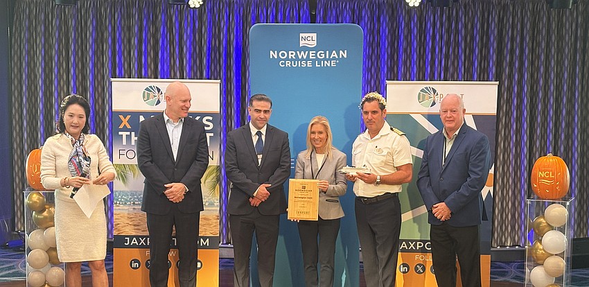 Jacksonville Port Authority Board Vice Chair Soo Gilvarry, Jacksonville City Council member Nick Howland, Norwegian’s Senior Director of Port Operations Louis Ruiz, Jacksonville Mayor Donna Deegan, Norwegian Gem Captain Doro Manzi, and Visit Jacksonville President and CEO Michael Corrigan take part in ceremonies aboard Norwegian Cruise Line's ship Gem on Oct. 31.