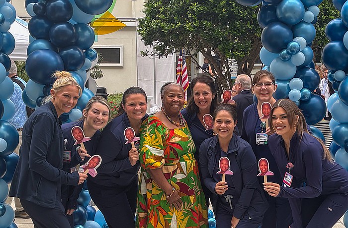 Registered Nurse Clara Rock started at Sarasota Memorial Hospital as an assistant in high school. She poses with her Labor and Delivery team at the celebration.