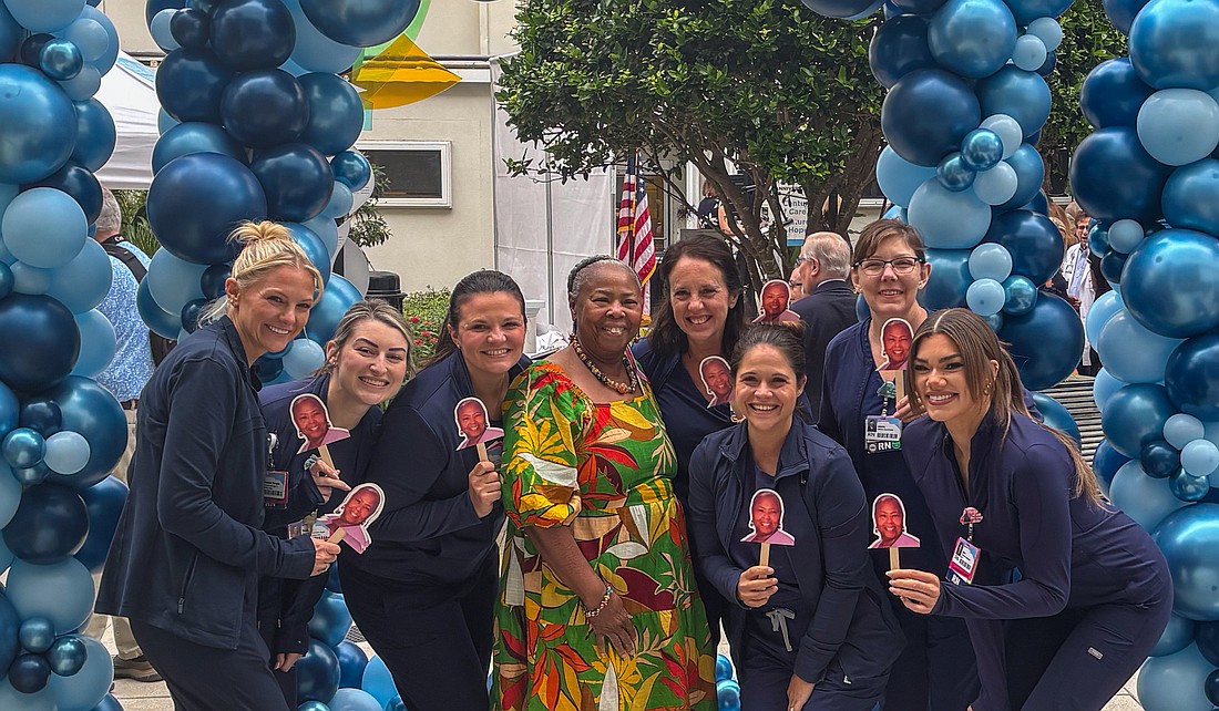 Registered Nurse Clara Rock started at Sarasota Memorial Hospital as an assistant in high school. She poses with her Labor and Delivery team at the celebration.