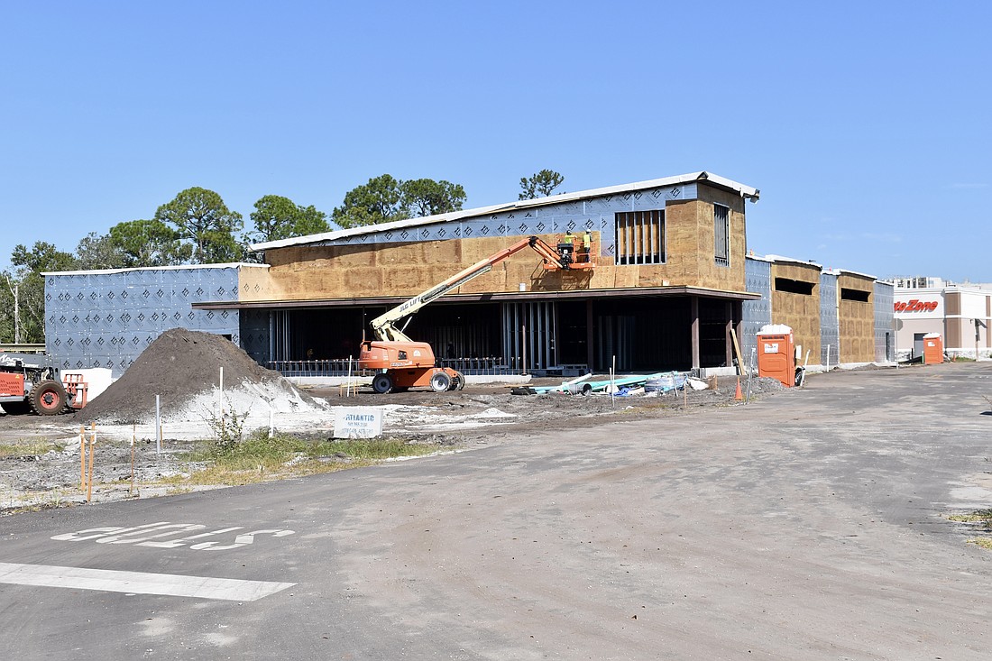 An Aldi grocery store is under construction next to the Outback Steakhouse on Crossland Trail.