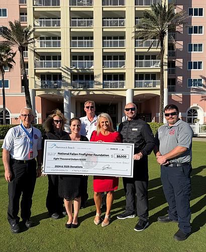 Flagler County Fire Chief Michael Tucker, firefighter/paramedic Tracy Farmer, Fire Marshal Jerry Smith, Hammock Beach Golf Resort & Spa's Nicole O'Neill, founder of 9/11 Memorial Tribute Climb Lacy Martin, Hammock Beach Golf Resort & Spa's Adam Dennison and firefigher/paramedic Christopher Ellis. Courtesy photo
