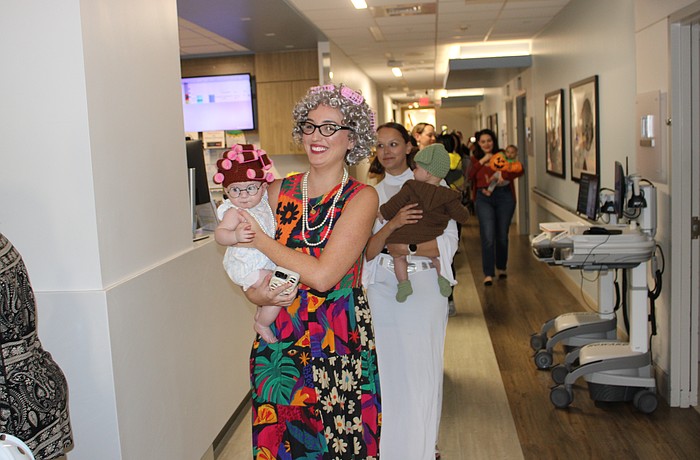 Sweetwater's Monica Zacour and 5-month-old Everly curl through the parade route at Lakewood Ranch Medical Center Oct. 29.