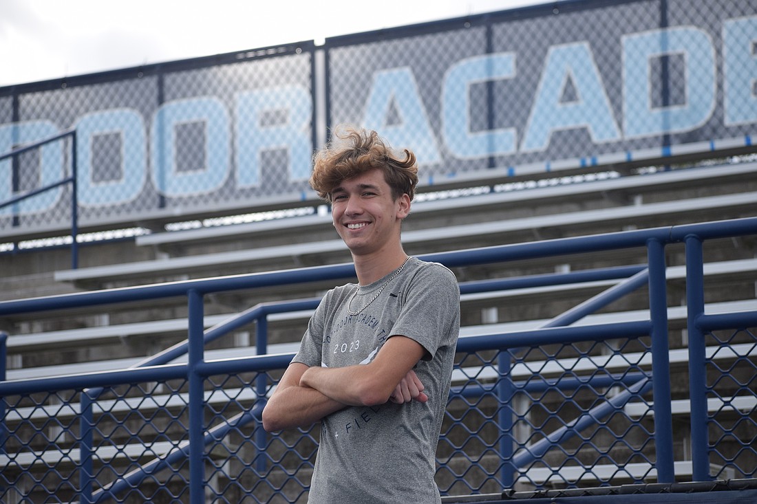 Kevin Gyurka poses for a photo on Oct. 31 at Out-of-Door Academy's Thunder Stadium. The senior long-distance runner has won two races in the 2025 cross country season, and boasts five top-10 finishes in seven meets.