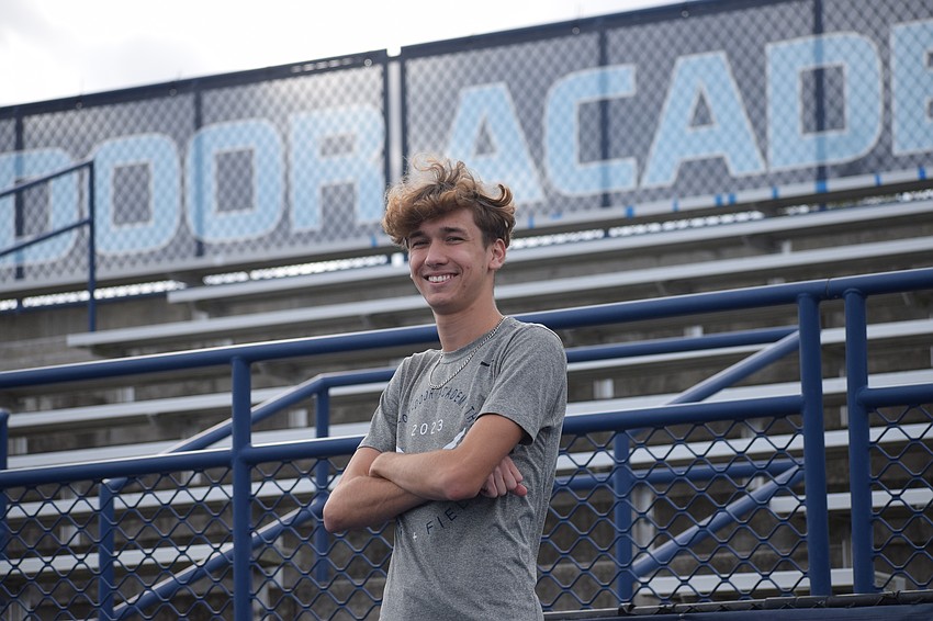Kevin Gyurka poses for a photo on Oct. 31 at Out-of-Door Academy's Thunder Stadium. The senior long-distance runner has won two races in the 2025 cross country season, and boasts five top-10 finishes in seven meets.