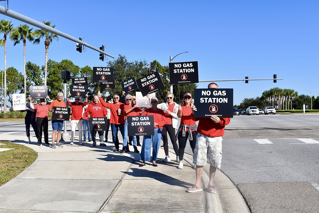 The Lakewood Ranch Community Action Group protests a possible gas station on the corner of 44th Avenue East and White Eagle Boulevard Nov. 1.
