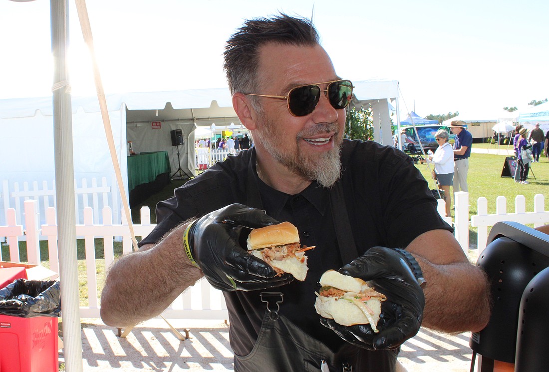 Evan Percoco, co-owner of Twisted Pit BBQ of Lakewood Ranch, dishes out samples at the Rotary Club of Lakewood Ranch's Suncoast Food and Wine Fest, Nov. 1 at Premier Sports Campus.