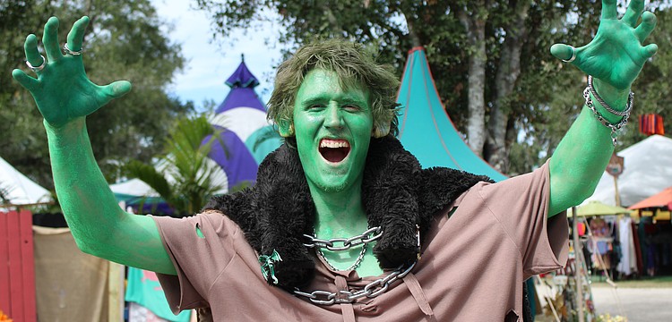 Cape Coral's John Svidroniv IV paints himself green as a goblin for the Sarasota Medieval Fair, where creatures of all shapes and sizes gather for a magical day.