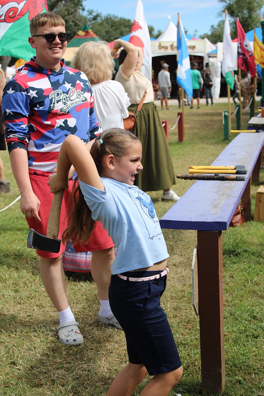 Port Charlotte's Evalene Abad, 6, gives her all to axe throwing, which makes her feel powerful and strong.