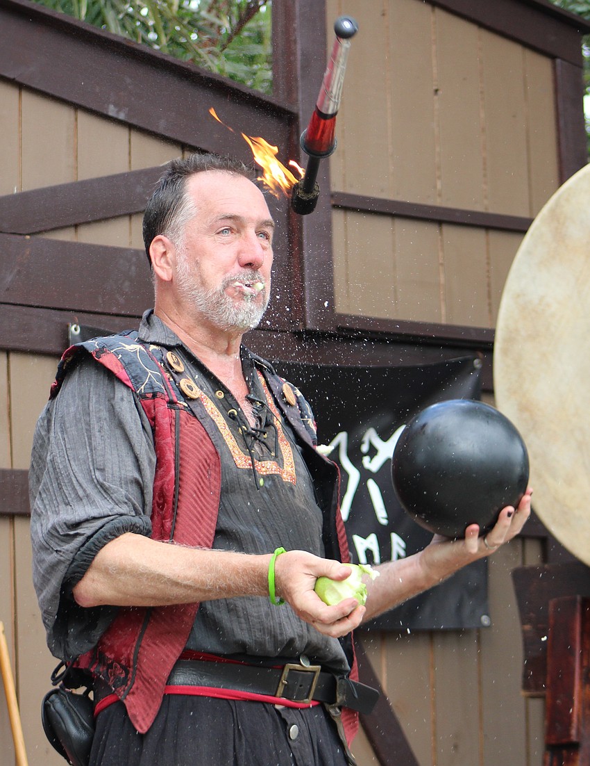 Broon, a comedian who provides a show that is fun for the whole family, juggles fire, a ball and an apple taking bites in between throwing it. He has been doing the apple trick for 30 years.