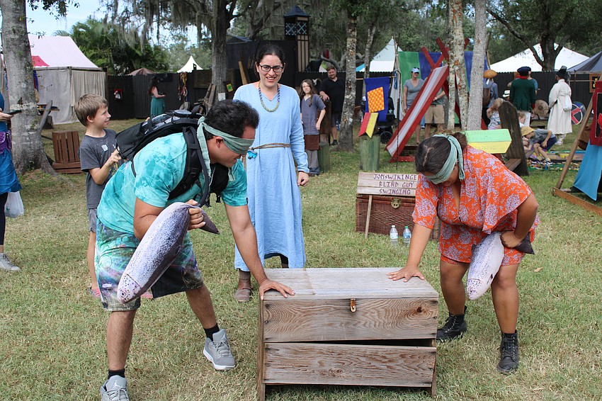 Brother and sister duo Clifton Burton and Kelly Harless play Jomswikinger, an old viking game. They must keep one hand on the chest, ask the question 