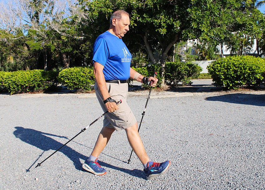 Enrico “Sam” DiGiammarino, Jr. demonstrates the proper technique for Nordic walking, which distributes weight through the arms to a pair of walking poles. As a trained instructor, he leads classes with several local organizations.