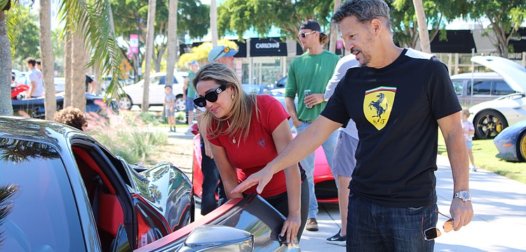 Kathy Lozano and Reuben Rivera check out the 2010 Ferrari 458 Italia that first-time registrant Jim Friedman brought to Ferraris on the Circle on Nov. 1.