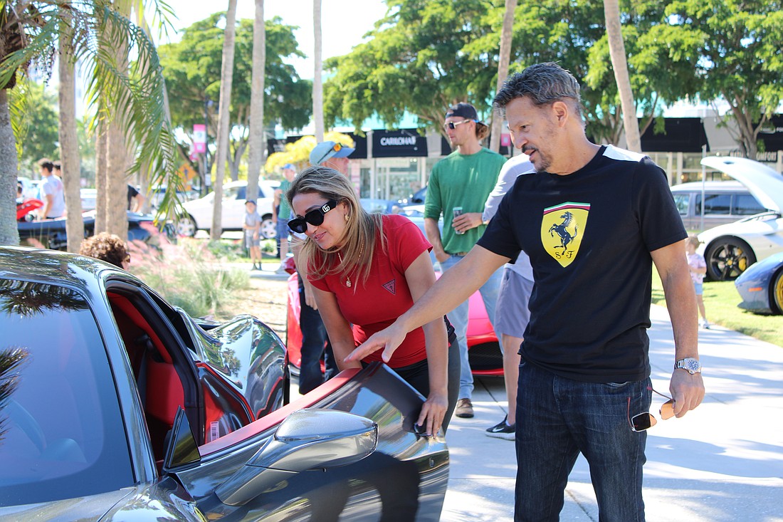 Kathy Lozano and Reuben Rivera check out the 2010 Ferrari 458 Italia that first-time registrant Jim Friedman brought to Ferraris on the Circle on Nov. 1.