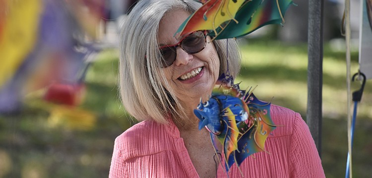 Cindy Mastrin browses the items on display.