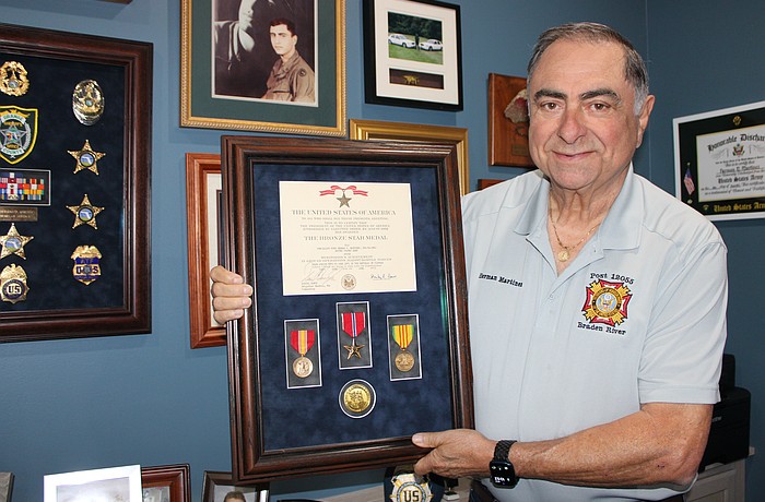 Lakewood Ranch's Herman Martinez shows off medals he earned with the U.S. Army while serving in Vietnam. Martinez said if asked to serve today, he would go.