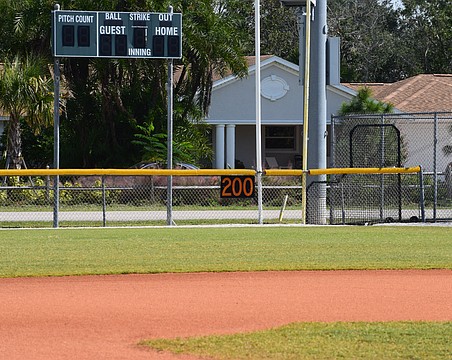 A 200-feet marker and scoreboard are pictured at one of the fields in Twin Lakes Park, the home of Sarasota Little League.