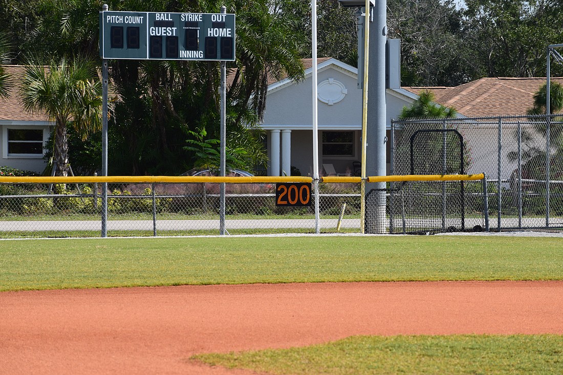 A 200-feet marker and scoreboard are pictured at one of the fields in Twin Lakes Park, the home of Sarasota Little League.