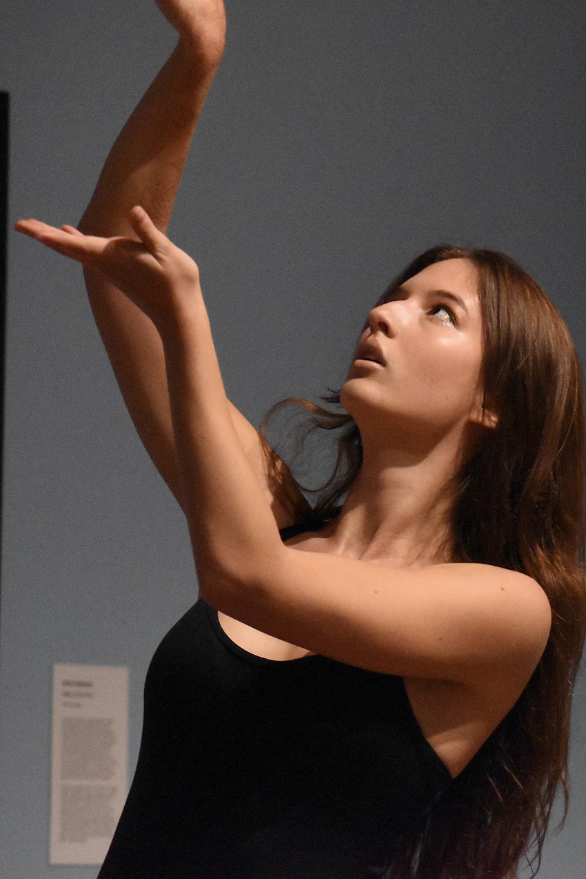 Booker High School senior Gabrielle Helmer dances in the second floor gallery.